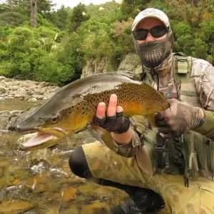 Colby Colbert from Youtube Channel "Black Creek Ops" holds a mighty fine brown trout up to the camera. Another client with whom LAB K. has provided branding and marketing strategy.